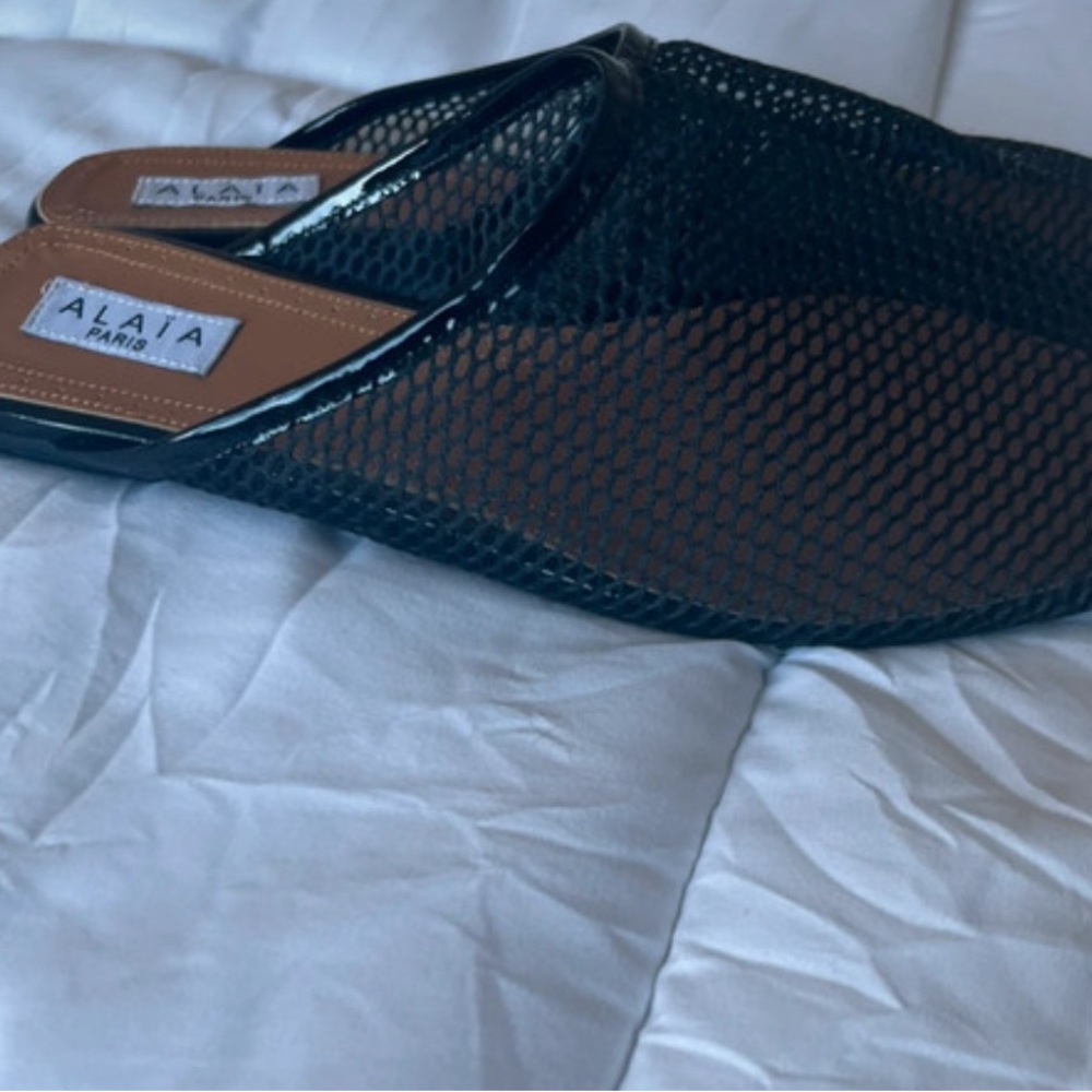 ALAÏA
Fishnet Mules